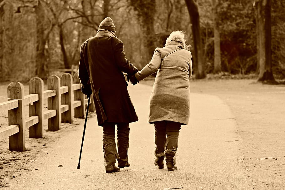 People, man, woman, couple, walking, side by side, together ... Helping Customers Feel Smarter Through Thoughtful Tech